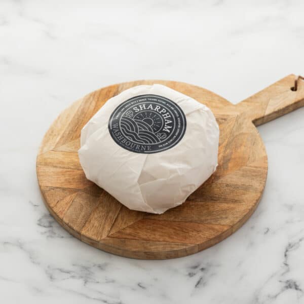 Sharpham Washbourne Ewes milk cheese wrapped with branded blue label